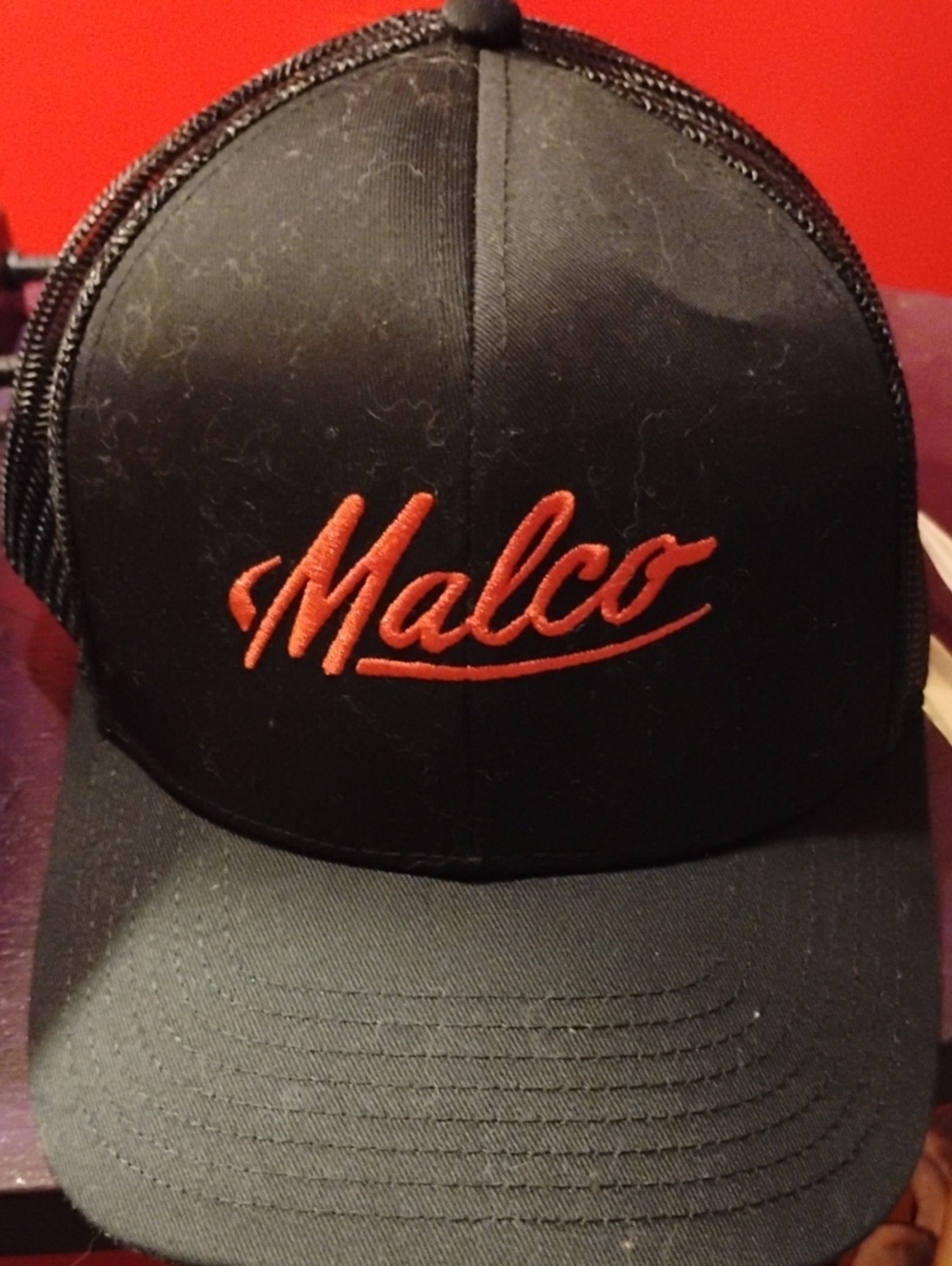 Malco Men's Black Trucker Hat with Red Script Logo